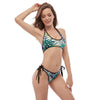 Femme en bikini Tangua vert avec liens noirs