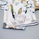Détail tissu legging sport femme gainant motif floral blanc — Couleurs Lagon