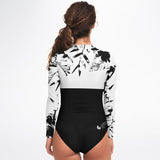 Rashguard femme MITI Hibiscus Noir & Blanc UPF50+ portée de dos, mannequin 1 - Couleurs Lagon