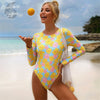 Combi Surf Manches Longues Dos Nu Push-Up ASTER & RUDBECKIA - Couleurs Lagon - avant et plage
