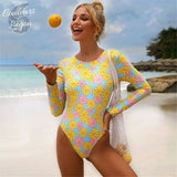 Combi Surf Manches Longues Dos Nu Push-Up ASTER & RUDBECKIA - Couleurs Lagon - avant et plage